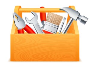 Wooden toolbox full of tools.